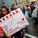 Tyra Hemans, 19, a student who survived the shooting at Stoneman Douglas High School, waits to board bus in Parkland, Fla., on Feb. 20, 2018.